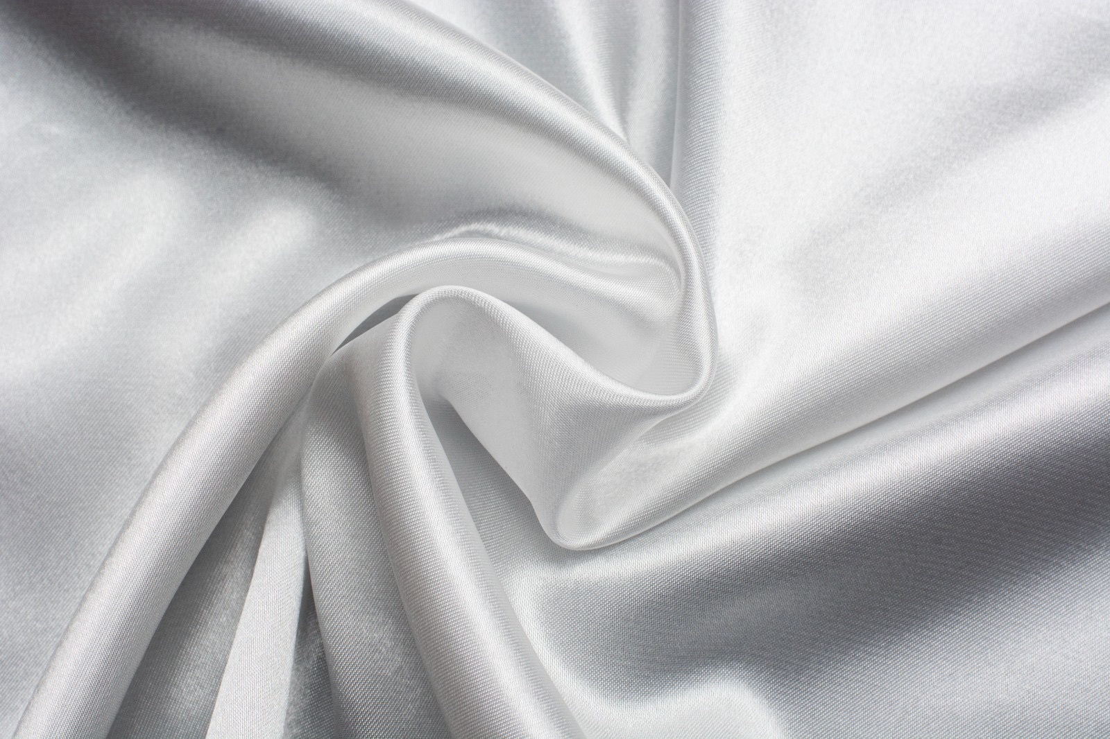 Undyed white satin fabric, swirled to show its drape